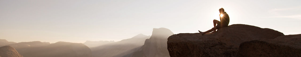 Man on a mountain during sunset