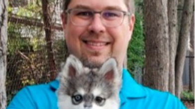 Ed Goluch with husky puppy