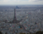 Aerial view of Paris with the Eiffel Tower centered.