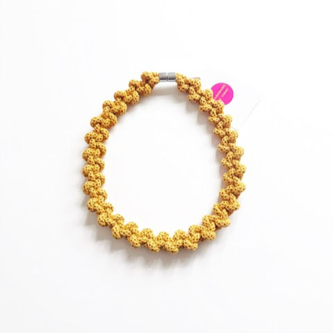 Close up of chunky textile Lily necklace in colourful organic cotton rope