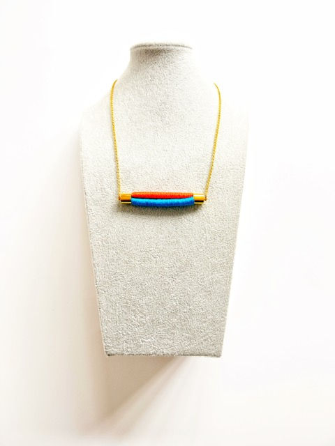 Thumbnail: close up of colourful rope necklace with wrapped thread detail