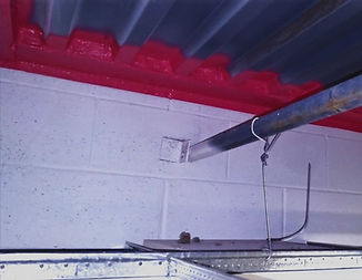 Firestopping applied to the top of a wall