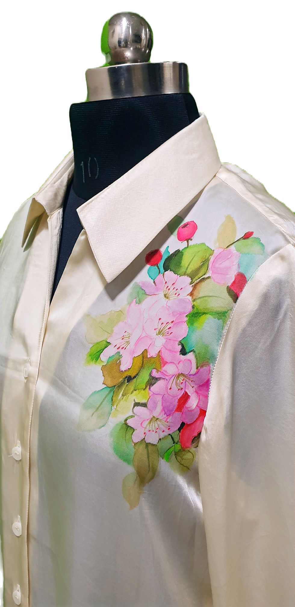 Thumbnail: Close up of a Beige silk shirt, hand painted with vibrant floral motifs draped on a mannequin for photography