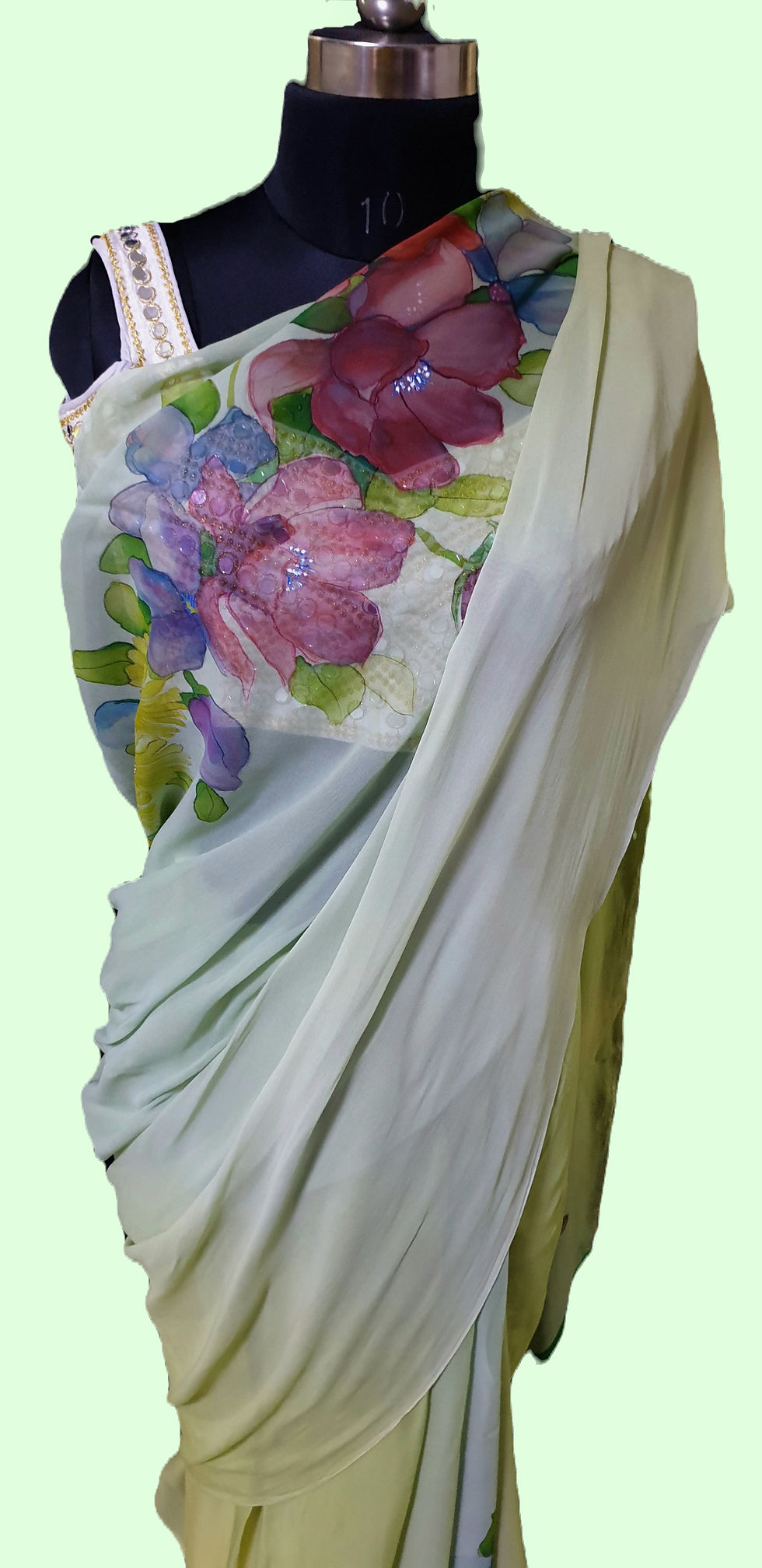 Thumbnail: Vibrant floral bouquet hand painted on pure georgette saree draped on a mannequin