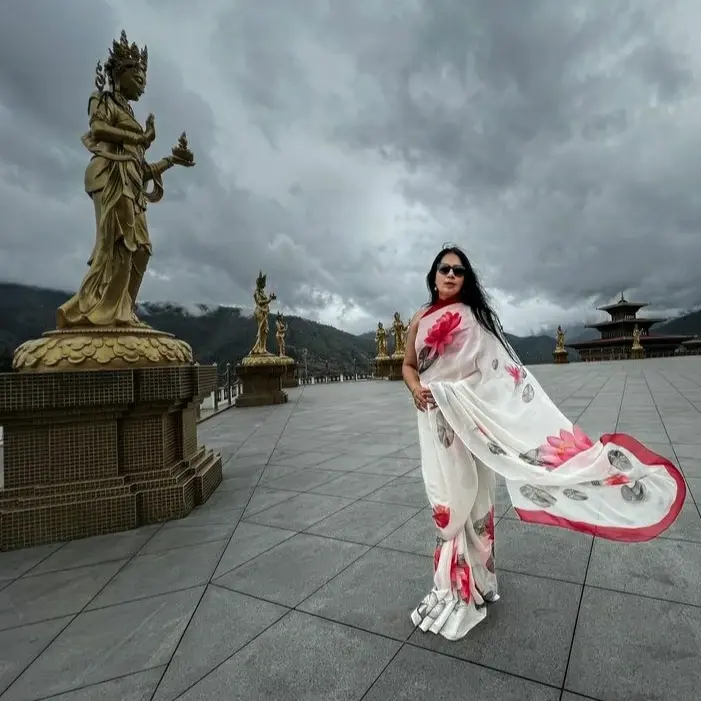 Thumbnail: Flat Chiffon white saree hand painted with lotus motifs, draped by Sangeeta Abhay in Bhutan