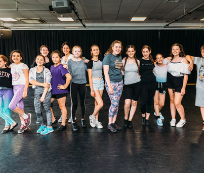 Young performers enjoying a musical theatre workshop in London