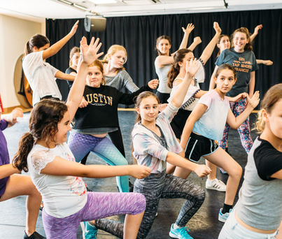 Students developing performance skills during a West End workshop