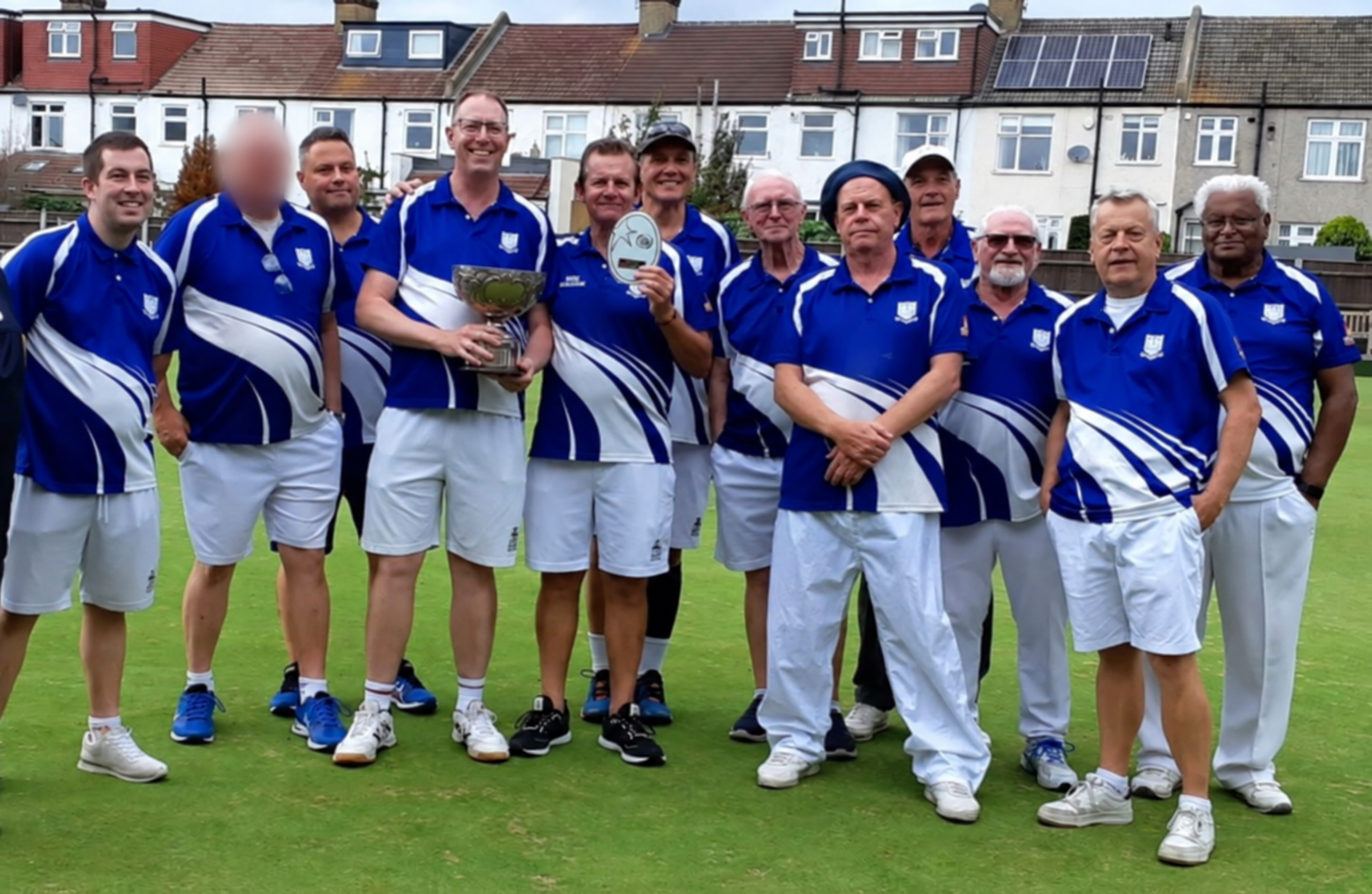 Southey Bowling Club team with trophies on the bowling green