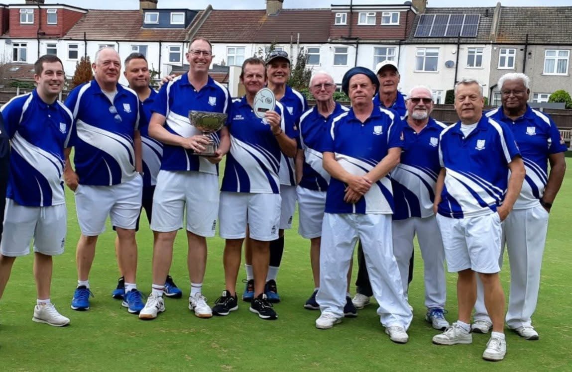 Southey Bowling Club team with trophies on the bowling green