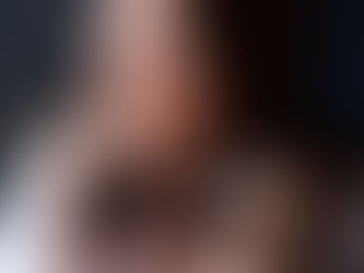 amanda hughes host of growth addicts podcast white female dark brown hair with headphones around neck smiling wearing blue and white striped shirt