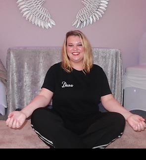 dana erwin of snowmoon therapies sat in crossed leg position short blonde hair smiling