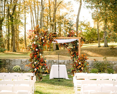 Outdoor wedding ceremony setup at Arrow Park with floral accents designed by Flowers by Jo-Ann.