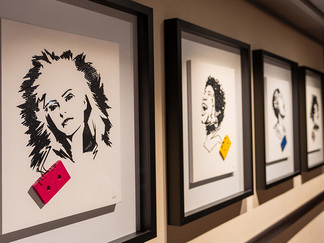 music themed portraits on wall
