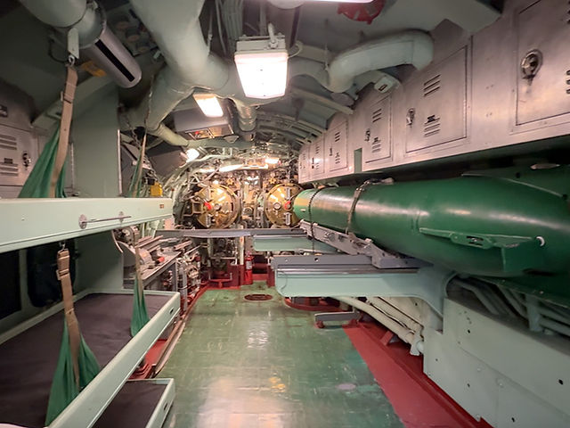 bunk beds and a torpedo inside a submarine