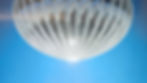 Translucent silver balloon-like airship floating in a starry blue sky, with a tiny black gondola hanging below.