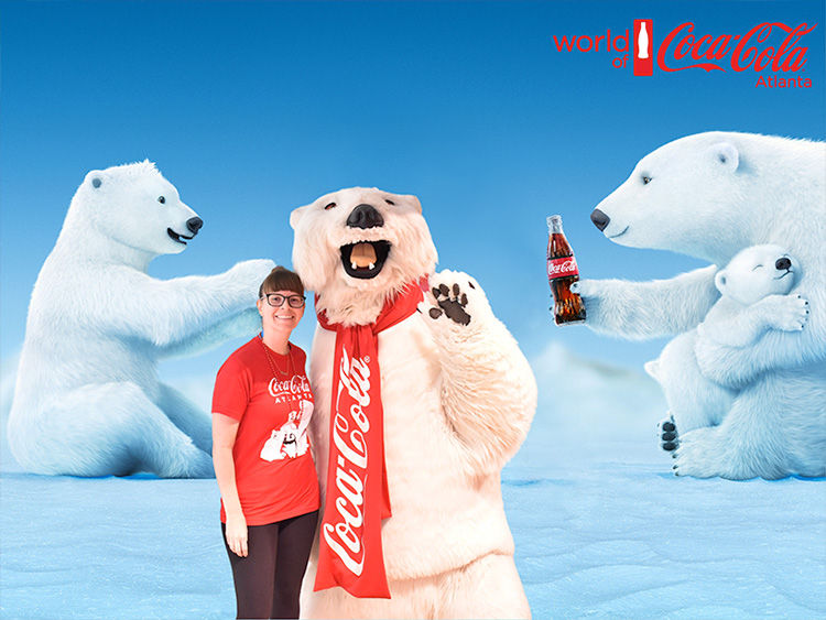 woman posing with Coca Cola polar bear