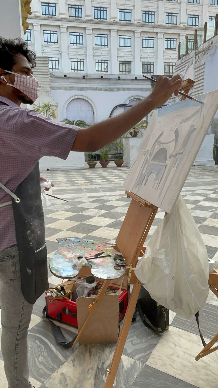 Indian artist painting outdoors