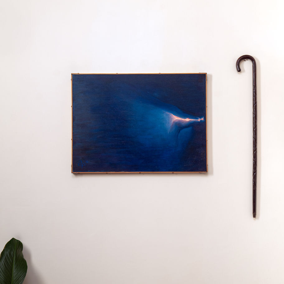 Abstract oil artwork in deep blue with bright light.