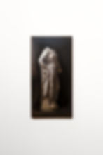 Oil painting of a draped headless statue.