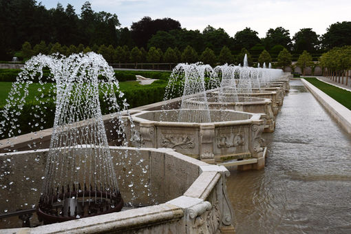 A row of octagonal fountains shooting water.