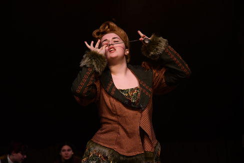 Spiker sniffs a watch chain.