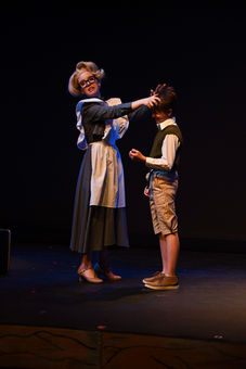 The Matron Nurse combing James' hair.