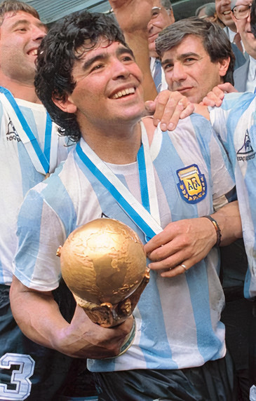 Diego Maradona holding World Cup