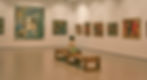 a woman sitting on a bench in a museum_edited.jpg