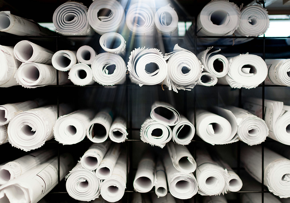 A rack full of rolls of white toilet pap