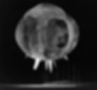 A large, glowing sphere with spikes hovers in dark space, resembling a celestial object or explosion, creating an ominous, surreal atmosphere.