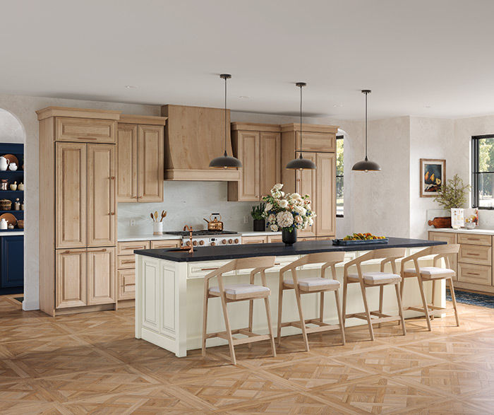custom white oak cabinetry inside kitchen with big island and barstools