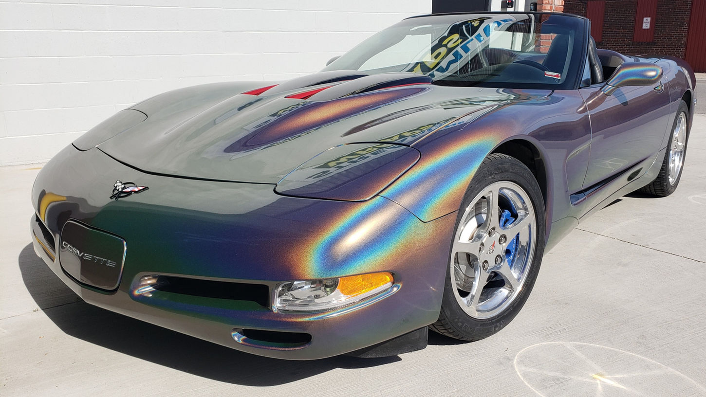 A stunning iridescent Chevrolet Corvette convertible in natural sunlight