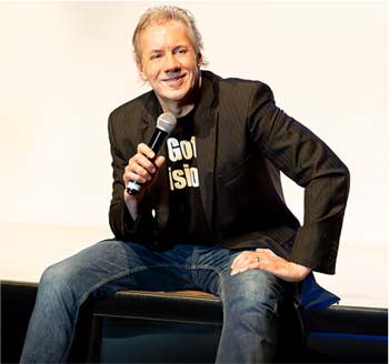 Steve Sitting On Bench Holding Mic.jpg