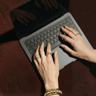 woman's hands on laptop