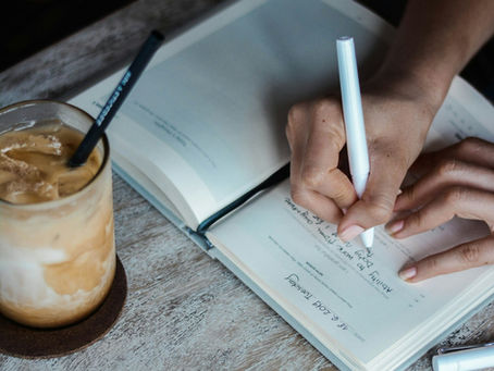 Woman writing in a journal