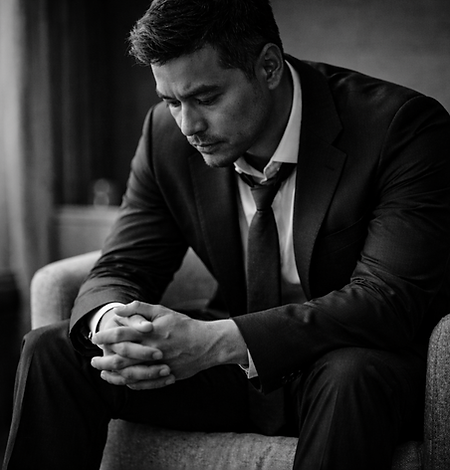 Man in suit, deep in thought about leadership resilience