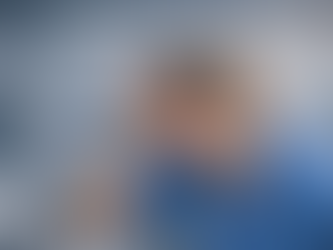 Female nursing student experiencing dizziness while standing in hospital setting, demonstrating orthostatic hypotension symptoms and low blood pressure response relevant to nursing education at Saving Grace Medical Academy.