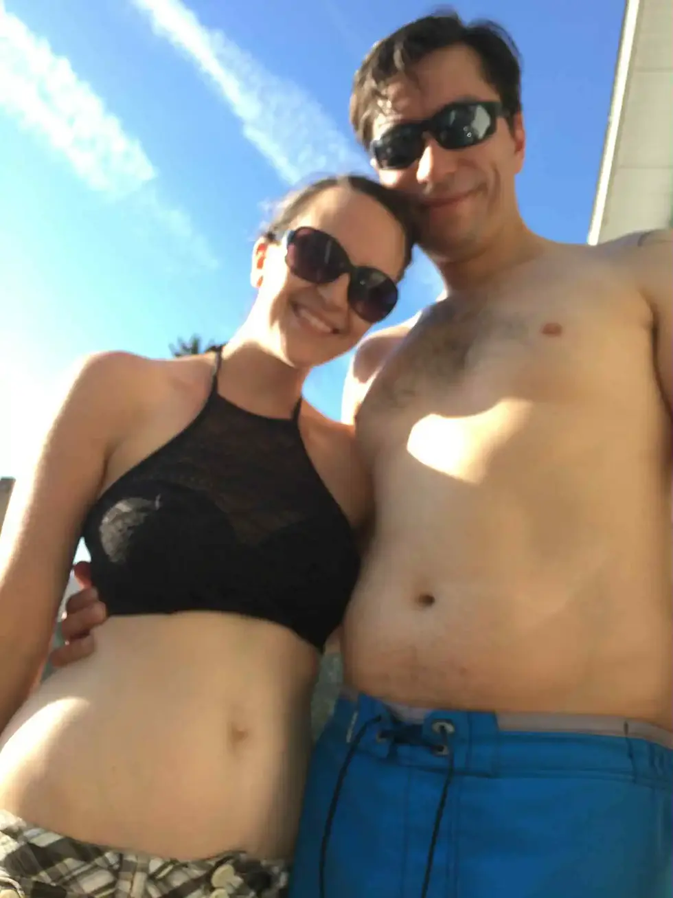 Jason Tschetter and his wife Emily smiling outdoors before Jason’s weight loss journey, representing the beginning of his Men’s Health transformation story with Saving Grace Medical Academy.