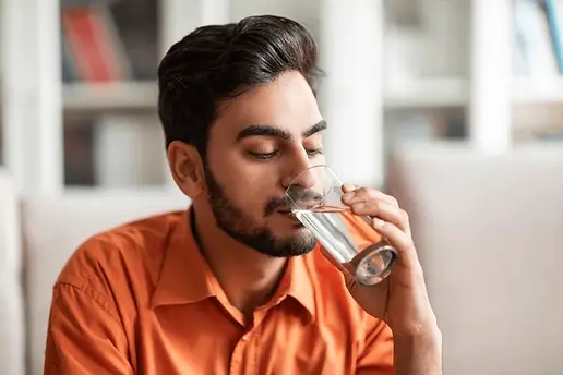 man drinking water
