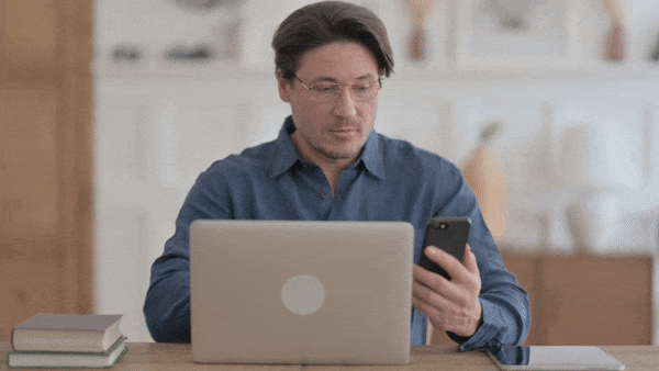 phone_laptop_man.gif