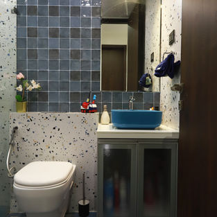 a bathroom with a toilet a sink and a mirror