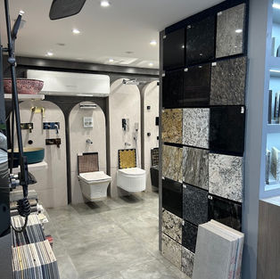 a bathroom with a wall mounted toilet and a sink