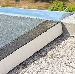 Roof thermal insulation with polystyrene panels covered with waterproof membrane under a c