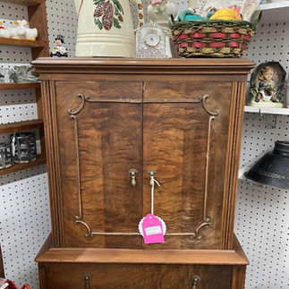 Antique storage cabinet with brass hardware