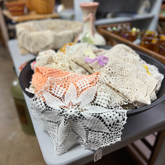 Bowl of antique doilies