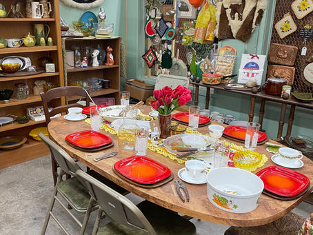 Dining table set with vintage dinnerware in antique mall