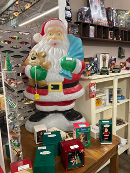 Vintage blow mold of Santa holding a bear