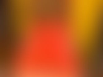 Vintage orange upholstered chair with handmade blanket