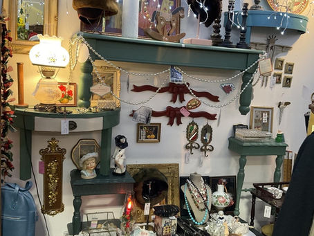 Antique mall booth decorated with vintage Christmas décor