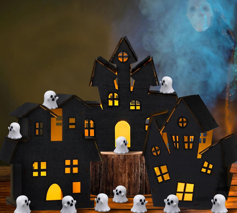 Black haunted house with ghost figurines